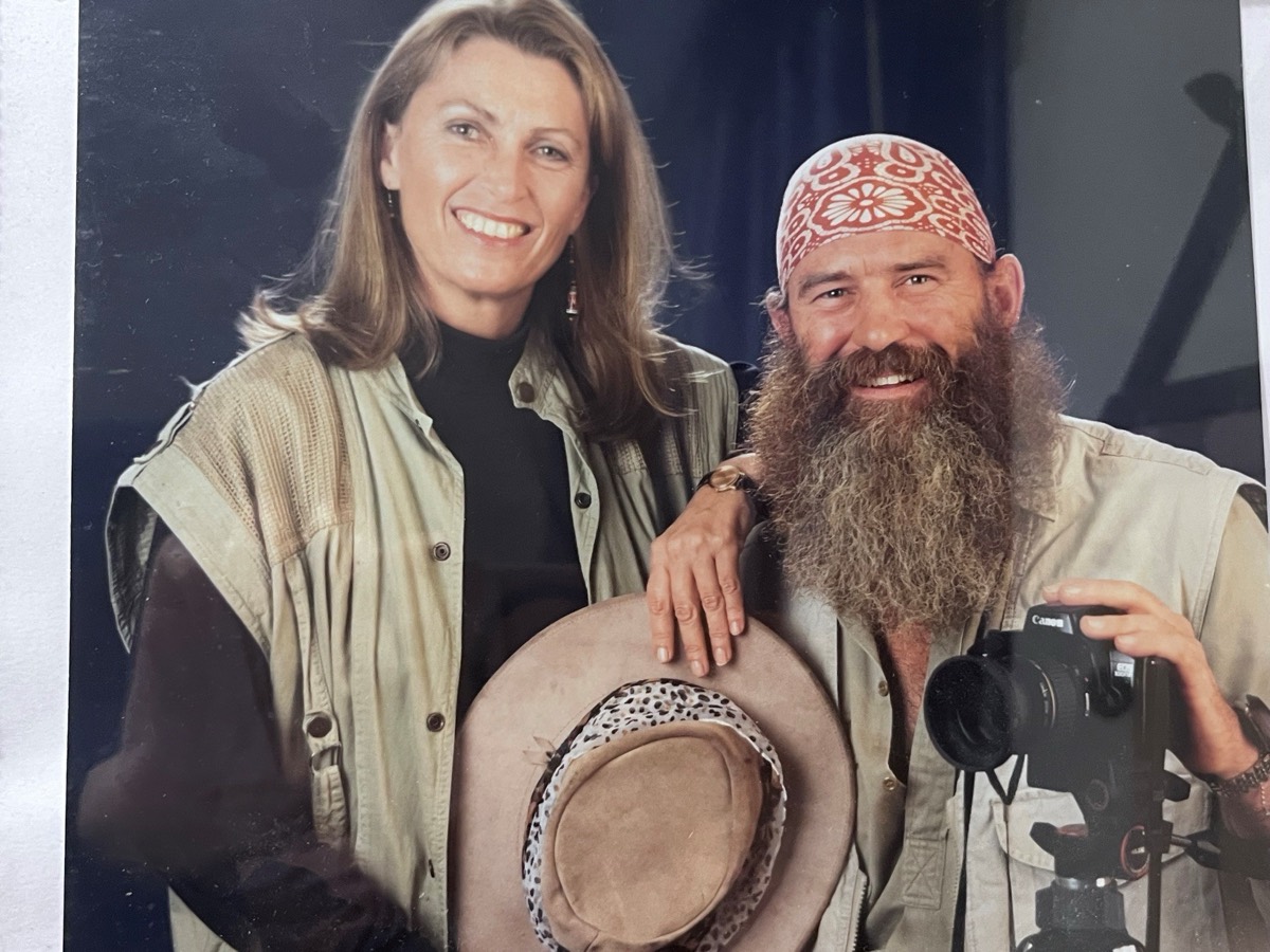 A young Jan and Jeremy in a studio portrait with safari hats and a camera